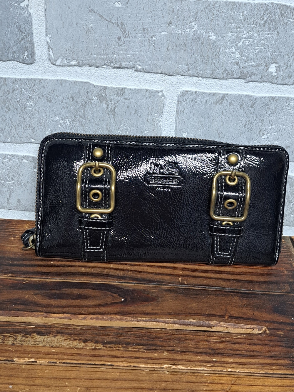 Coach Black Patent Leather Zip Wallet with Brass Buckle Accents